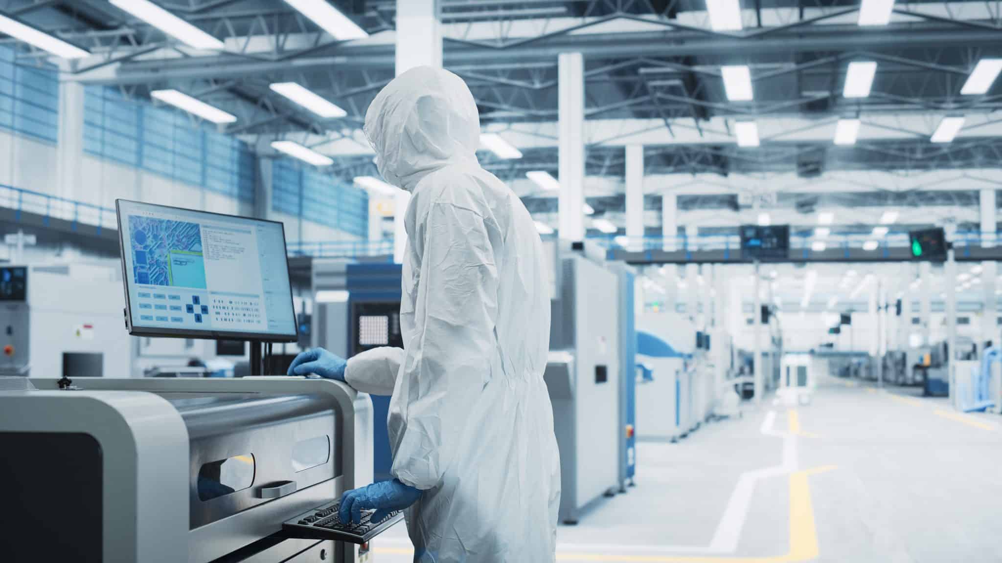 Circuit Board Production In a Factory Research Center with Scientist In Sterile Suit